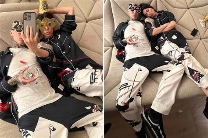 
Kourtney Kardashian and Travis Barker Celebrate New Year’s Eve in Matching Pajamas and Party Gear 