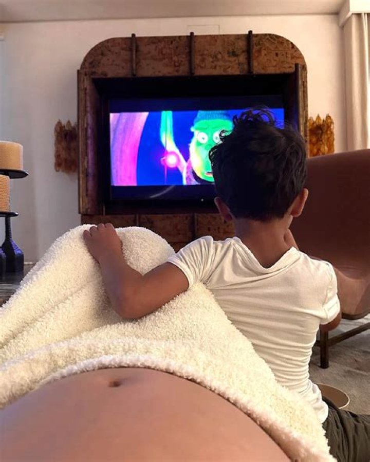 
Pregnant Chrissy Teigen Shares Sweet Photo of Daughter Luna, 6, Kissing Her Baby Bump 